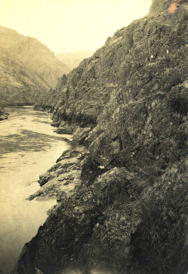 Men (almost hidden) on the rocky cliffs (in the upper right corner of the photograph). Photograph taken in the Box Canyon just south of Slate Creek on the Salmon River.
