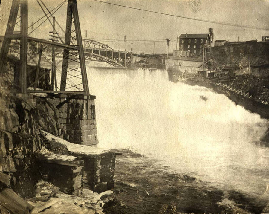 Looking north towards the falls. The second Monroe Street Bridge made out of steel is in the background.