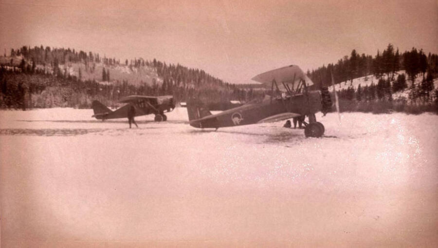 Two Zenith airplanes parked in a snowy meadow at Stonebraker Ranch in the Chamberlain Basin.