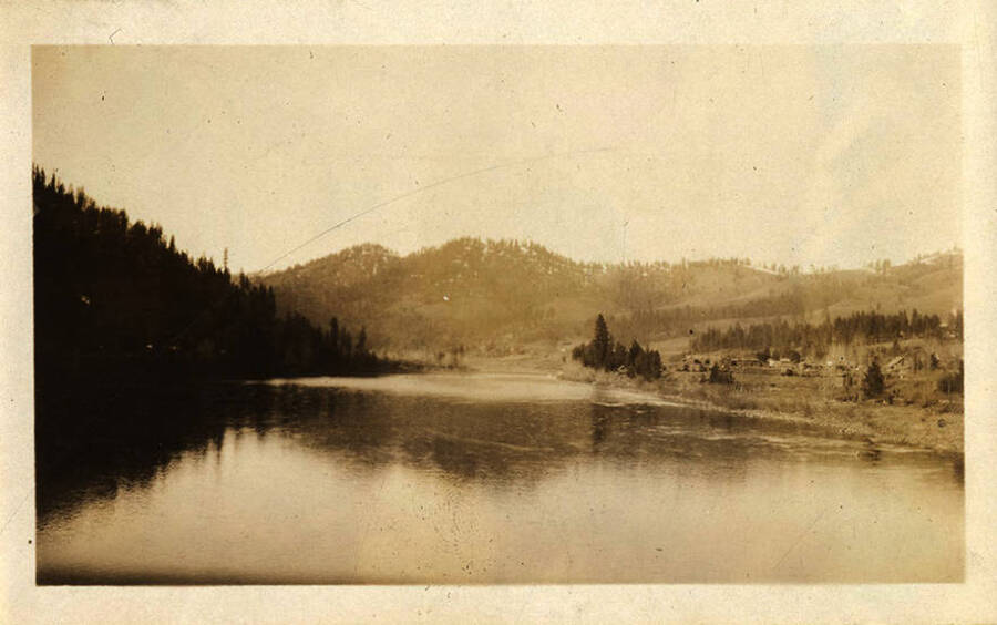 View of a river with a homestead on the right.