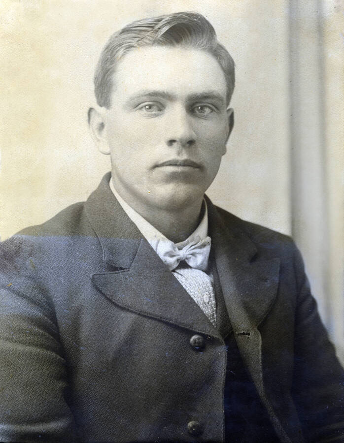 Portrait of William Allen Stonebraker wearing a dark jacket.