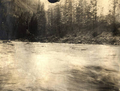 View of a fast moving river with some rapids.