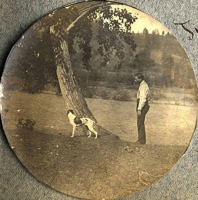 George Stonebraker, Jr. with dog named Juno next to the Clearwater River.