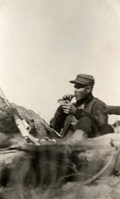 A hunter sits from a post high above the ground and bugles for elk.
