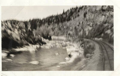 A scenic view along the Clearwater River from a moving train nearing Kooskia, Idaho.