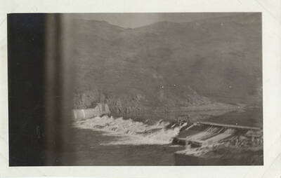 View of a dam and the mountains.