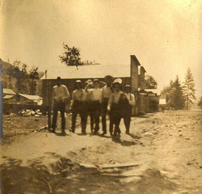 Stites ball team coming from practice. Seven men walk on the main street.