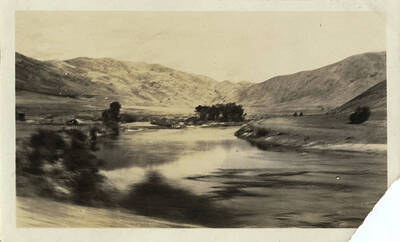 River view with homestead on the left.