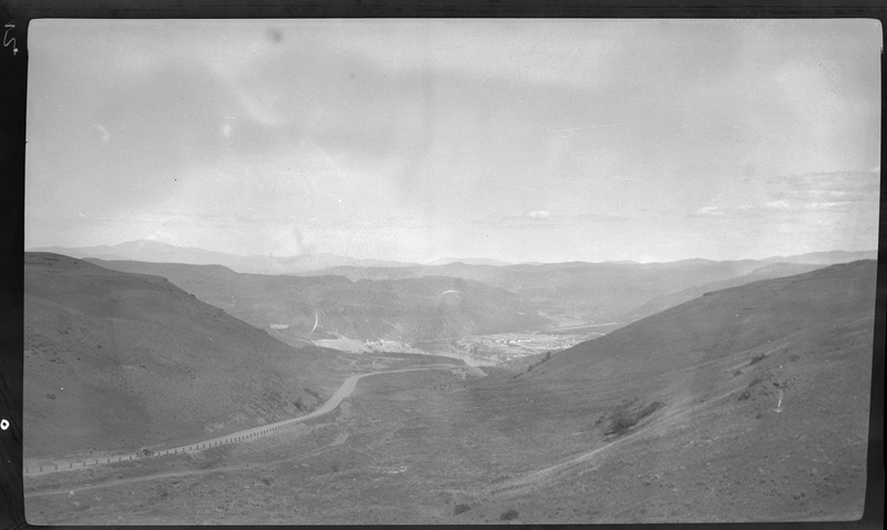Photo of the landscape near Coulee Dam. There is a road going through the area.