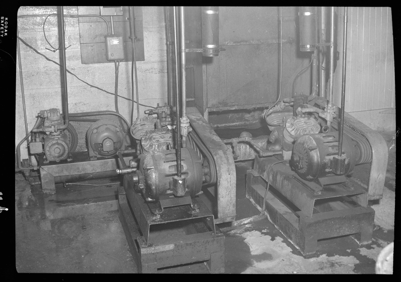 Photo of some small pieces of machinery inside the Wallace Meat Company building.