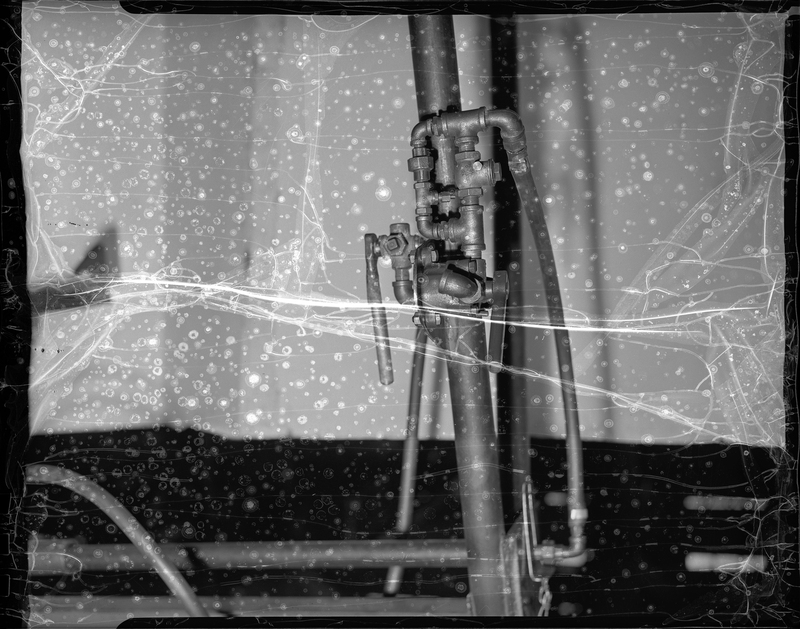 Photo of the building's hardware equipment inside the Coeur d'Alene Hardware company building. The negative is extremely damaged, but most of the detail is still visible.