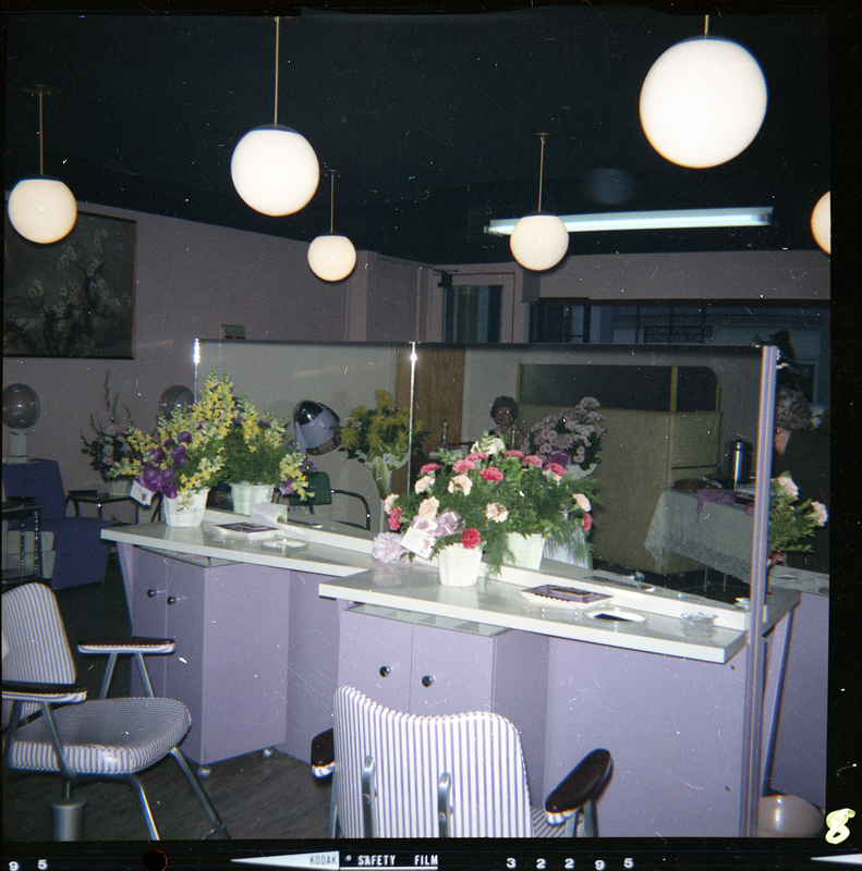 Photo of the interior of Beauty Marte during its store opening. Color photo of two of the workstations for doing hair.