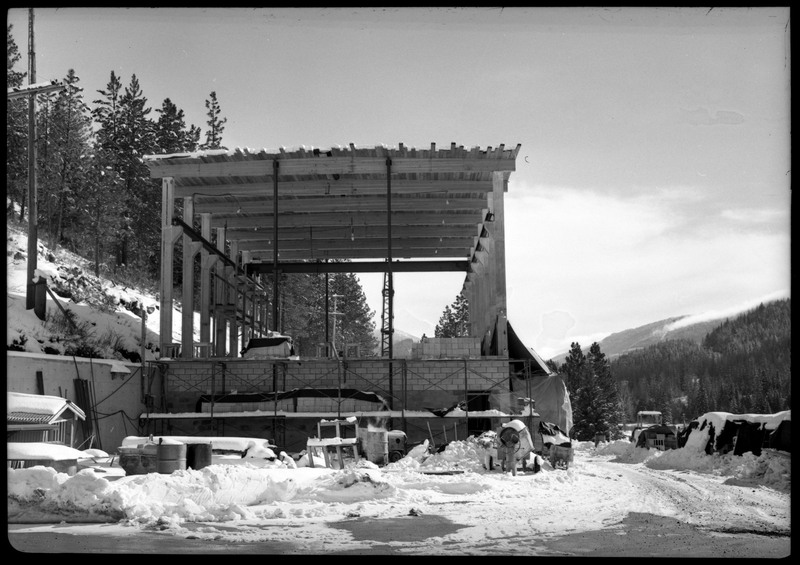 A building at Lucky Friday Mine that appears to be under construction. There is snow on the ground surrounding the area.