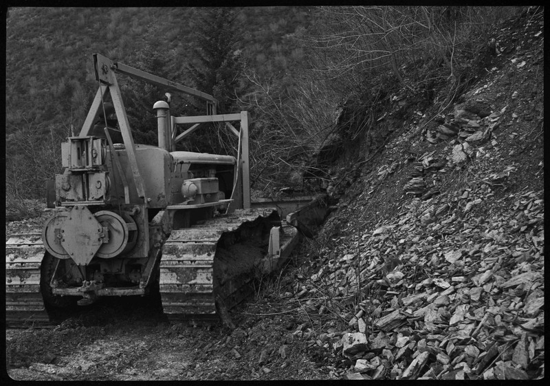 A piece of machinery moving through the dirt of the Greenough Operation at Lucky Friday Mine.