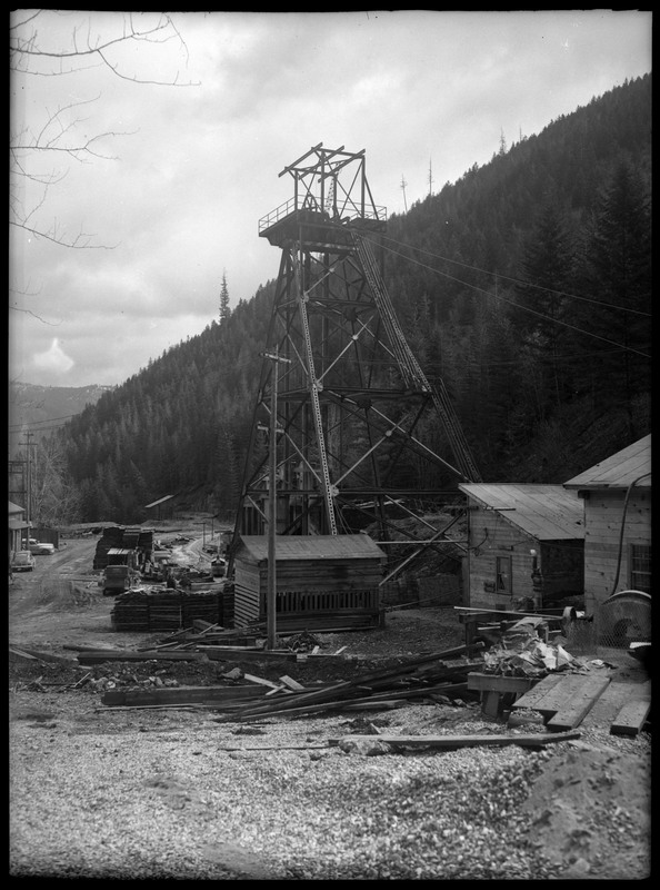 Image of the Rock Creek Mine tower. Notes say that Rock Creek Mine is 4 miles east of Wallace, Idaho. The area appears to be under construction.
