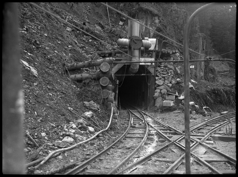 Entrance into Rock Creek Mine through their rail system. Notes say that Rock Creek Mine is located 4 miles east of Wallace, Idaho.