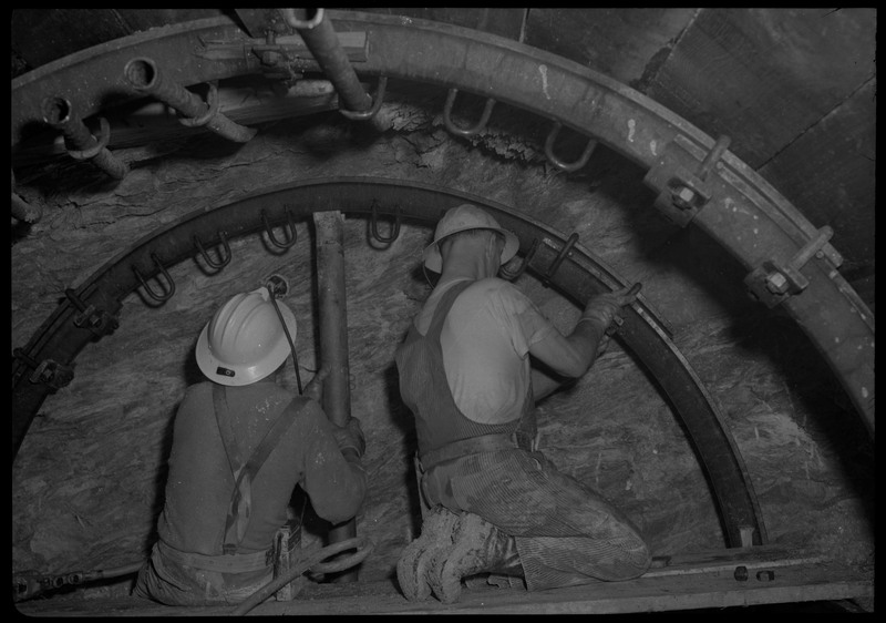 Two men working inside of Silver Mountain.