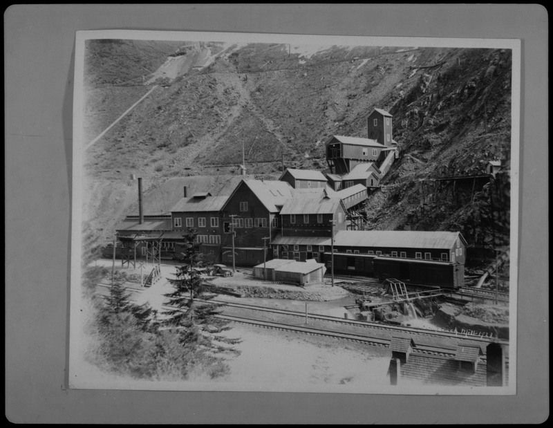 Image of a photograph of Tamarack Mill in New Meadows, Idaho. The photo shows the milling complex and surrounding landscape.