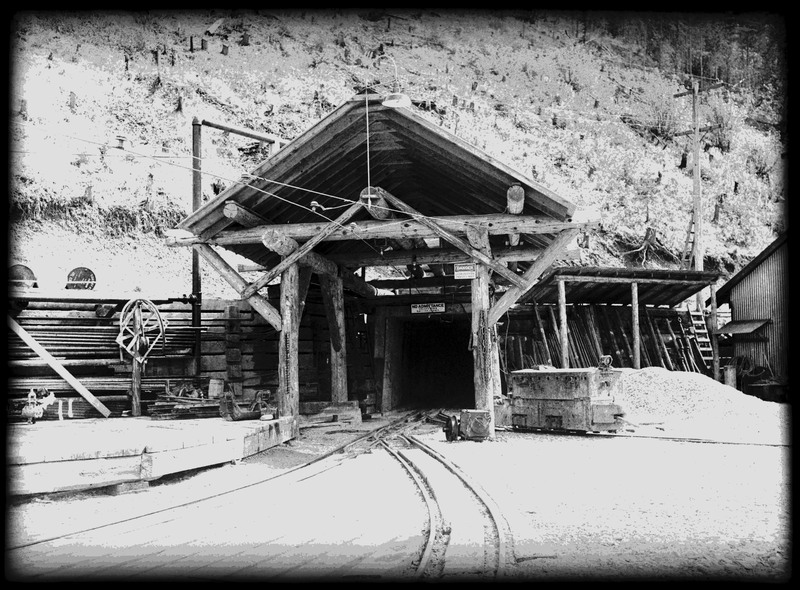 Entrance into the Silver Summit mine. There are railroad tracks on the ground for mine carts.