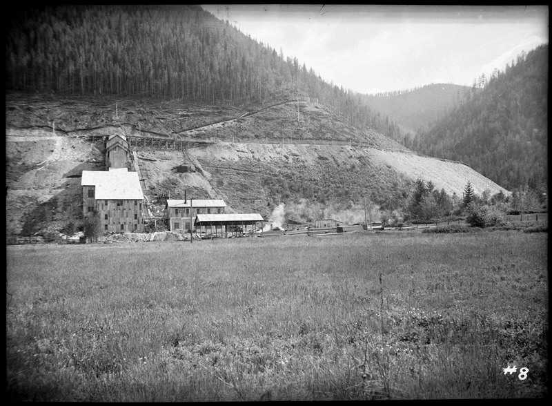 Image of the Silver Summit mine complex from a distance. The buildings that go up the hill are visible.