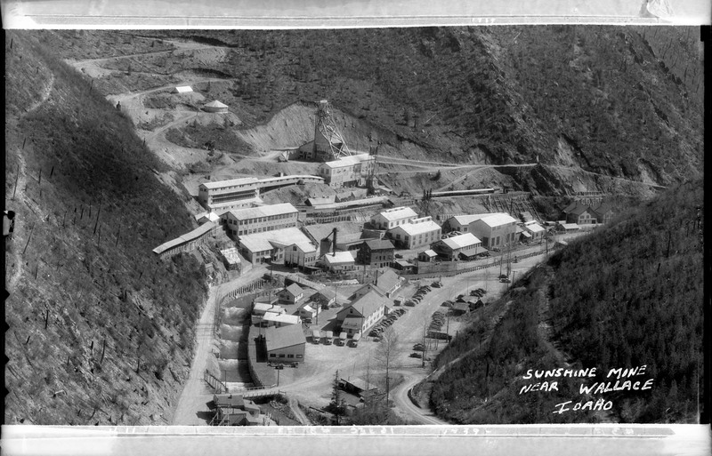 Image of a photograph overlooking Sunshine Mine near Wallace, Idaho. The entire mining complex is visible.
