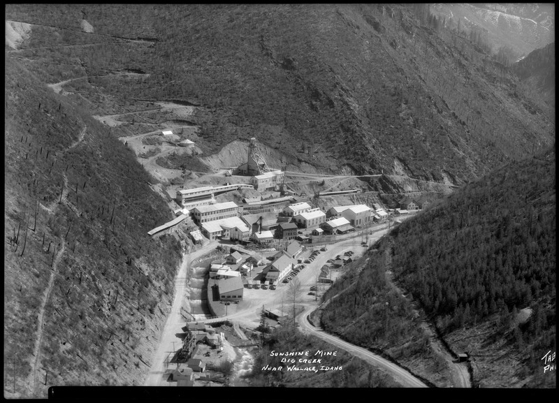 Image overlooking the Sunshine Mine complex in Big Creek, Idaho. The whole mining complex is visible including buildings and trucks.