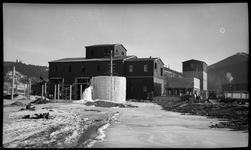 An unidentified milling complex. One of the buildings is completely frozen over with ice.