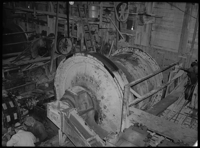 Image of a cylinder ore grinder within an unspecified mine.