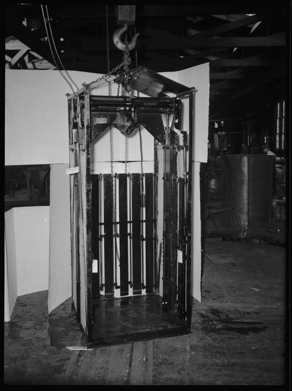 A mine cage inside of an unidentified mine.