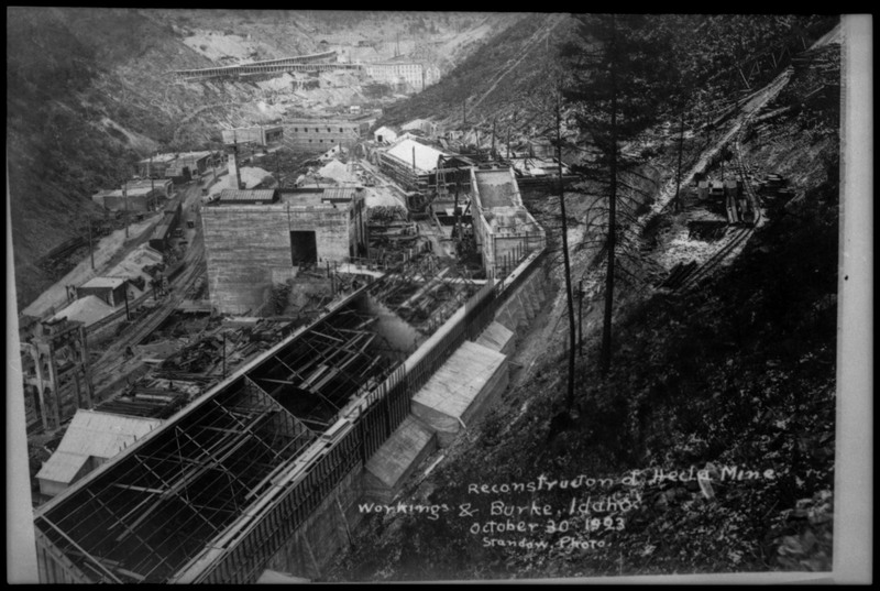 Image of a photograph of the reconstruction of Hecla Mine. Several buildings visible are under construction.
