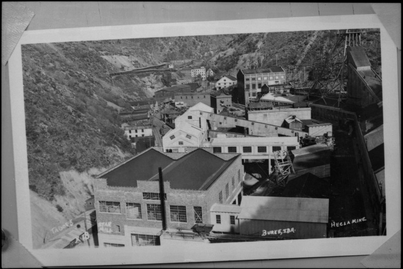 Image of a photograph of Star Mill and Hecla Mine in Burke, Idaho. Many buildings for both complexes are visible.