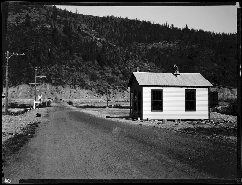 A small building built off a dirt road. Likely the backside of the Sunshine Mining Company Employment office.