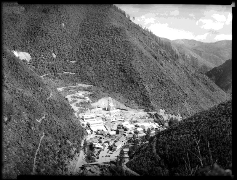 Image overlooking Sunshine mine and the surrounding tree covered area.