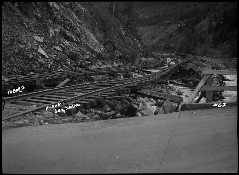 Image of the damage caused by the Gem, Idaho flood. The railroad tracks near the river were damaged.