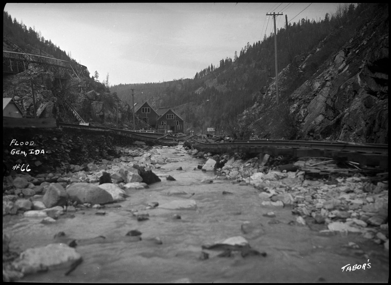 Image of the damage caused by the Gem, Idaho flood. The railroad tracks near the river were damaged.