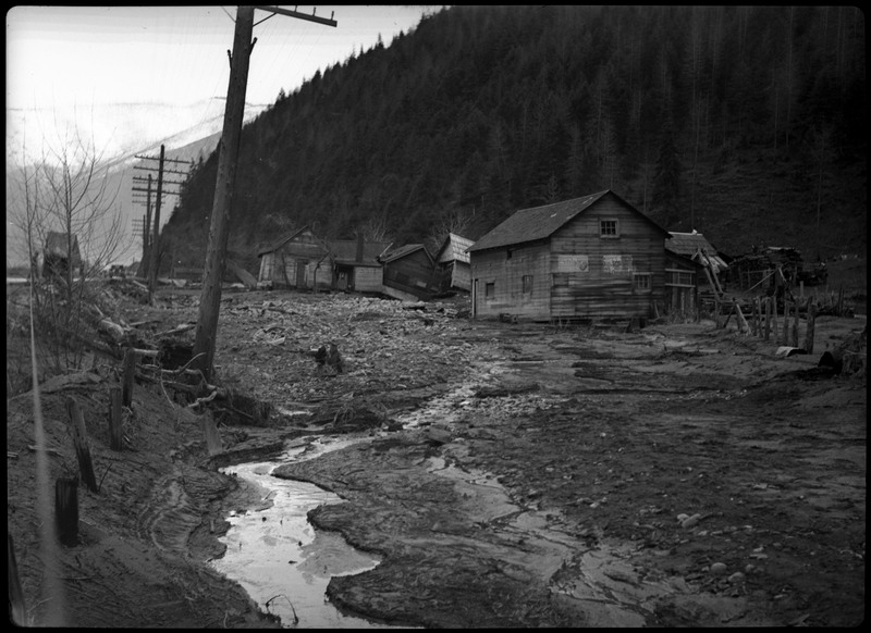Several damaged houses after a flood in Wallace, Idaho.