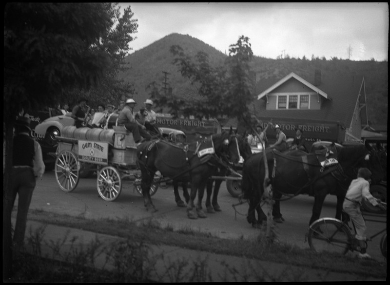 The Gem State Beer wagon drawn by horses during a parade.