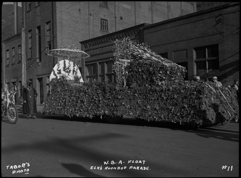W.B.A. float decorated with foliage and streamers during the Benevolent and Protective Order of Elks roundup parade.