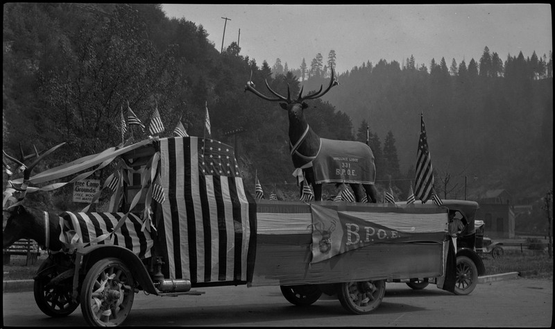 B.P.O.E. float decorated with American flags, an elk, and streamers during the Benevolent and Protective Order of Elks day parade.