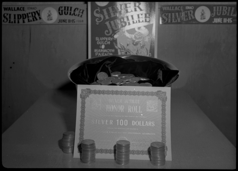 A certificate and stacks of silver dollars during the Silver Jubilee kickoff banquet.