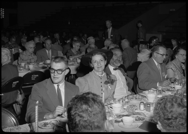 People seated at dinner tables during the Silver Jubilee banquet.