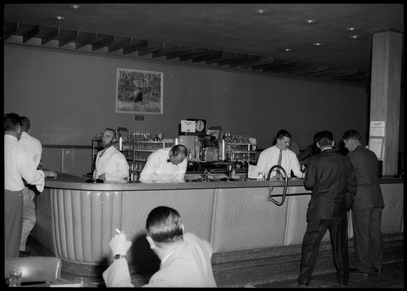 Bartenders and waiters at the bar area during the Silver Jubilee banquet.