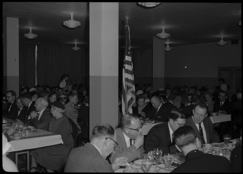 People sitting and eating at tables during a Knights of Columbus Jubilee event.