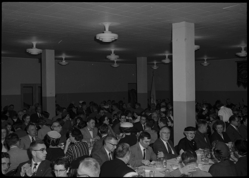 People sitting and eating at tables during a Knights of Columbus Jubilee event.
