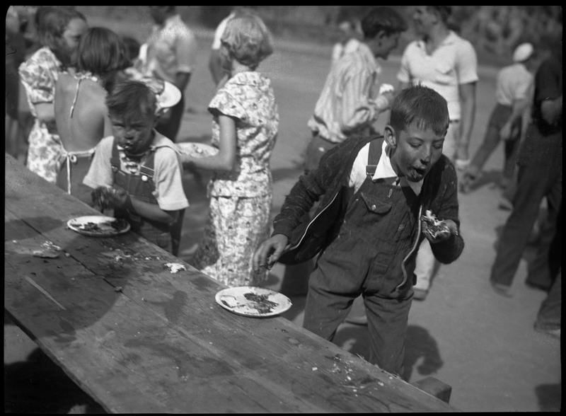 Children with pie covered faces during a pie eating contest.
