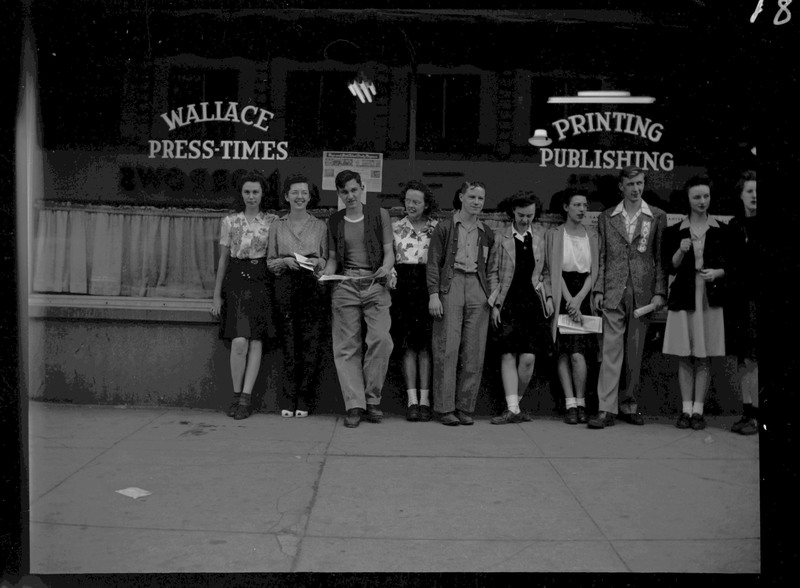 Teenagers standing in front of the Wallace Press-Times during Boys and Girls Week.