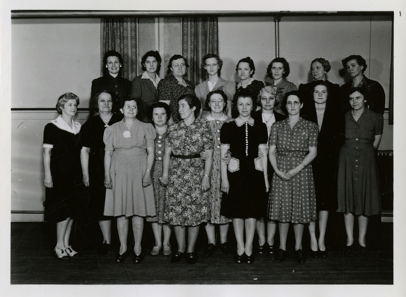 Nineteen unidentified women standing in two rows.