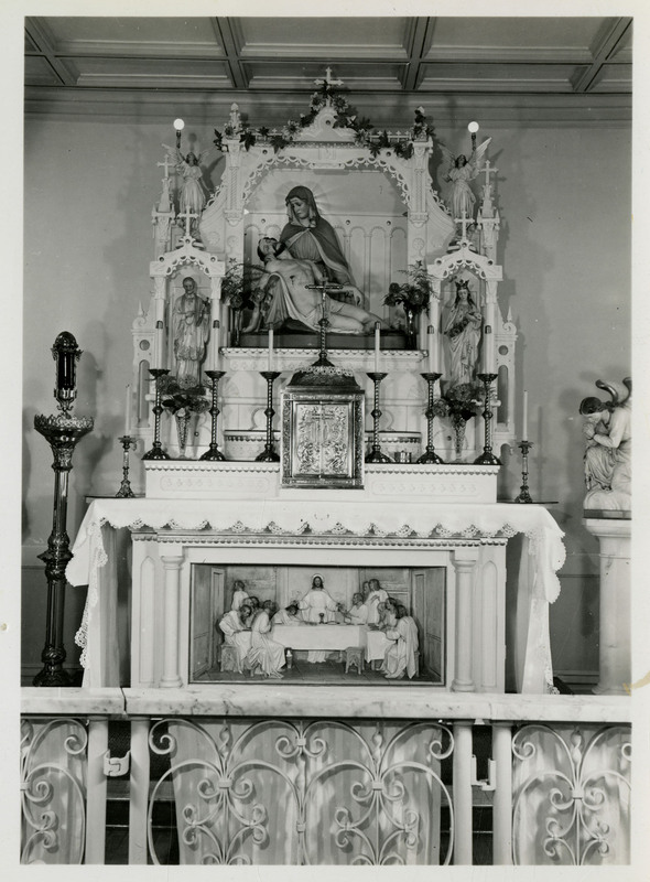Decorative chapel with various figurines and candles at Providence Hospital.