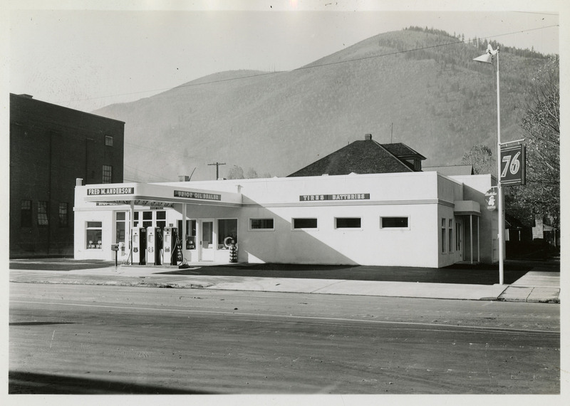 Another angle of the Union Oil Station and Bus Depot, mountains and trees in the background.