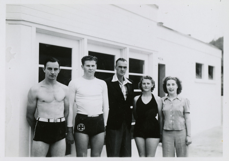 Three unidentified men and two unidentified women. Three of them wear swimsuits.